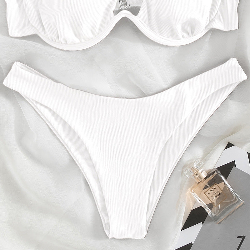 A stylish one shoulder black swimsuit featuring a sexy triangle cut and underwire support, perfect for beach or pool wear.