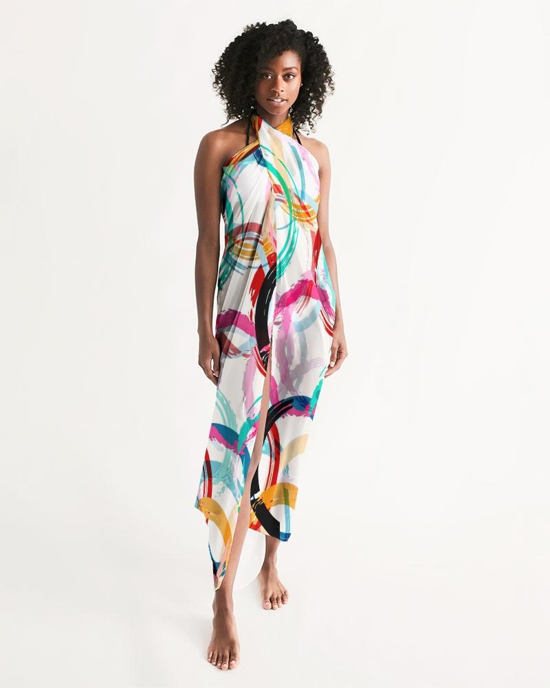 A vibrant sheer circular multicolor swimsuit cover up, featuring an abstract design, perfect for beach or pool wear.