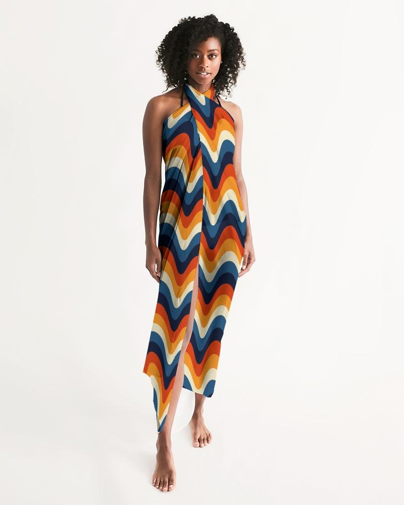 A vibrant sheer geometric multicolor swimsuit cover up draped elegantly, showcasing its lightweight fabric and stylish design.