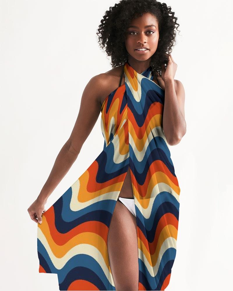 A vibrant sheer geometric multicolor swimsuit cover up draped elegantly, showcasing its lightweight fabric and stylish design.