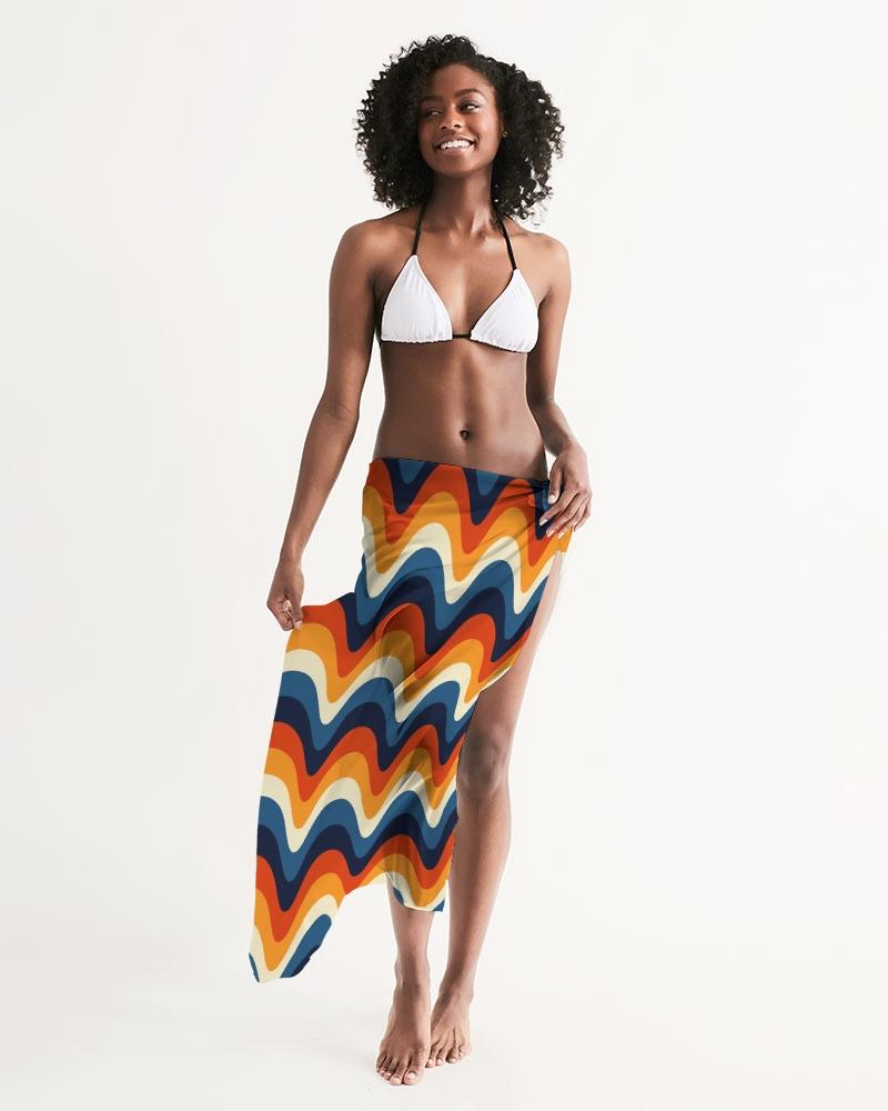 A vibrant sheer geometric multicolor swimsuit cover up draped elegantly, showcasing its lightweight fabric and stylish design.