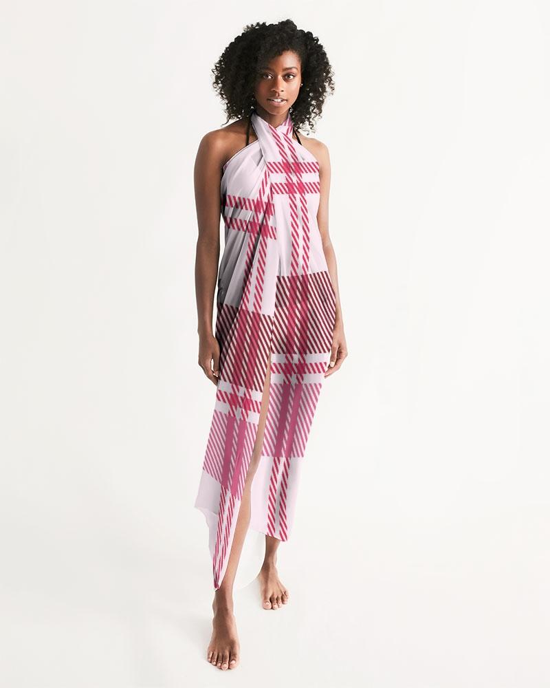A stylish sheer plaid pink swimsuit cover up draped elegantly, showcasing its lightweight fabric and self-tie closure.