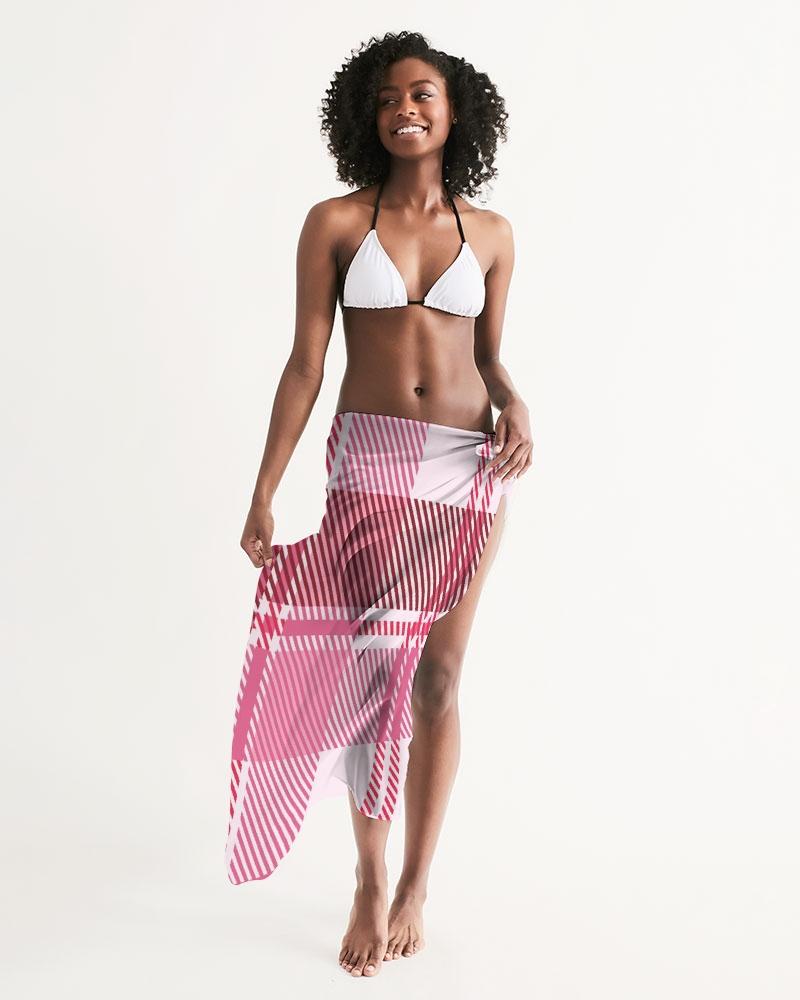 A stylish sheer plaid pink swimsuit cover up draped elegantly, showcasing its lightweight fabric and self-tie closure.