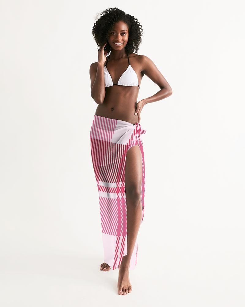 A stylish sheer plaid pink swimsuit cover up draped elegantly, showcasing its lightweight fabric and self-tie closure.
