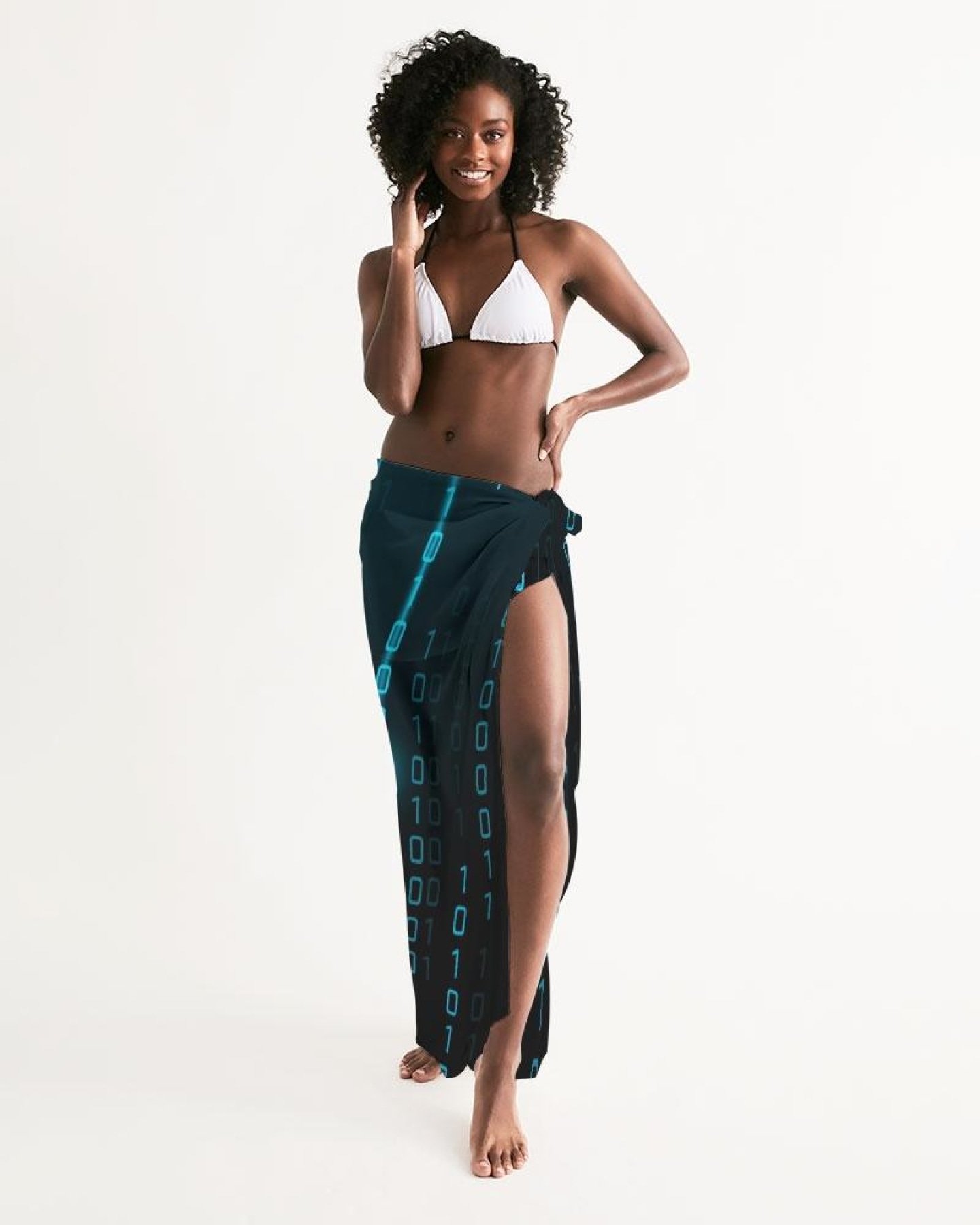 A lightweight blue sheer sarong swimsuit cover up wrap, elegantly draped on a beach setting, showcasing its flowing fabric and self-tie closure.