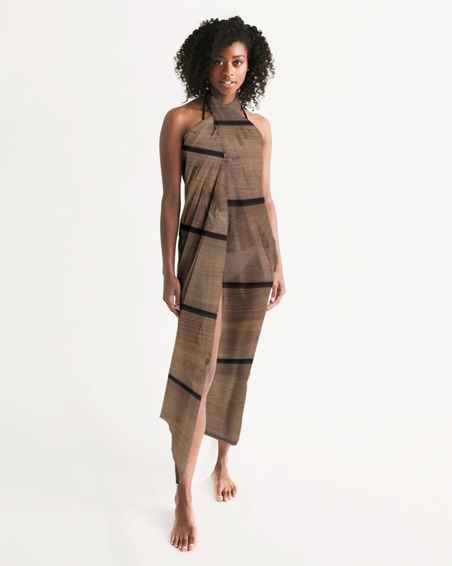 A lightweight sheer sarong swimsuit cover-up wrap in brown wood color, elegantly draped and showcasing its flowy fabric and self-tie closure.