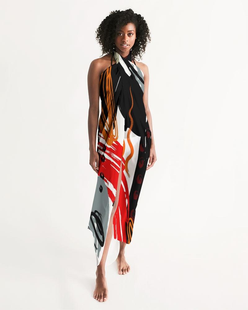 A vibrant sheer sarong swimsuit cover up wrap featuring an abstract circular design in black, red, and gray, perfect for beach or poolside wear.