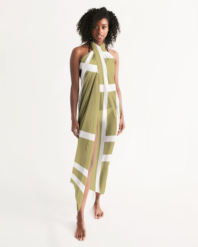 A lightweight sheer sarong swimsuit cover up in geometric beige and white design, elegantly draped on a model.