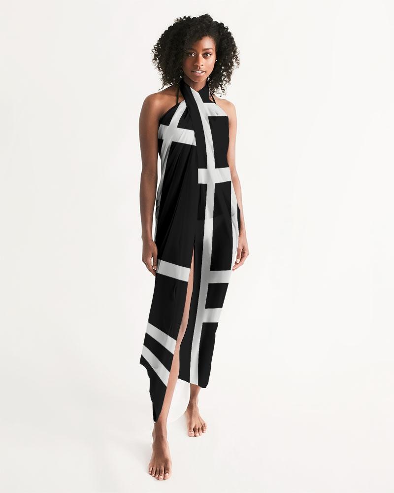 A stylish sheer sarong swimsuit cover-up featuring a geometric black and white design, perfect for beach or poolside wear.