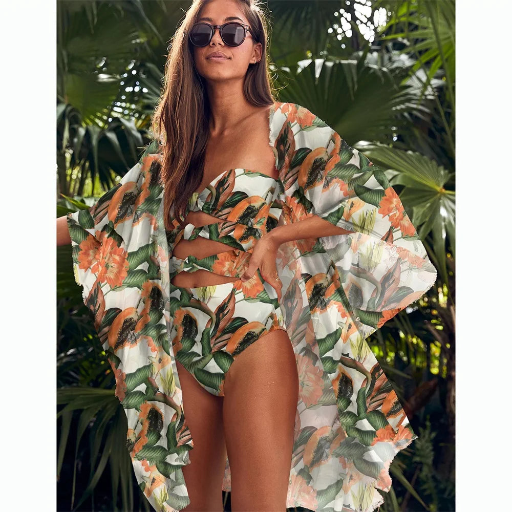 A vibrant yellow-green one piece swimsuit with a leaf print pattern, designed for women, perfect for beach and pool activities.