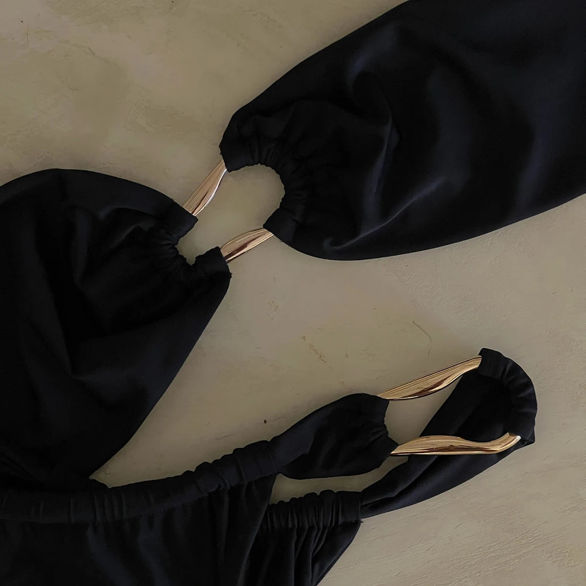 Zara-kay two piece swimsuit in black, featuring a sexy design with removable padding and wire-free support, perfect for summer beach outings.