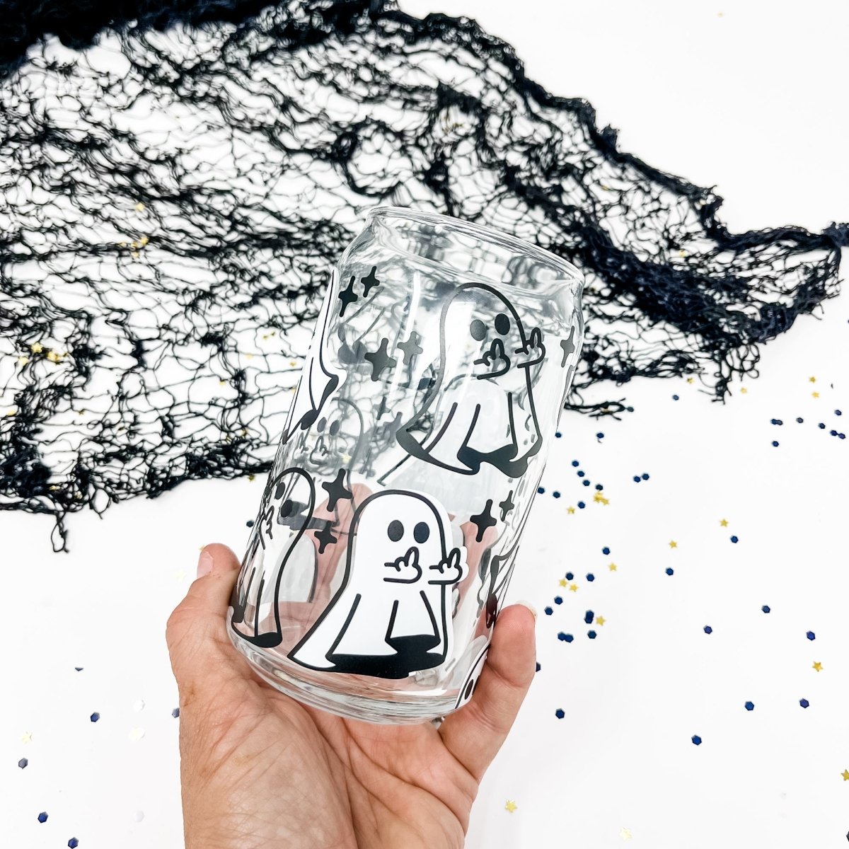 16 oz Beer Can Glass featuring a unique Middle Finger Ghost design, perfect for serving cold drinks.