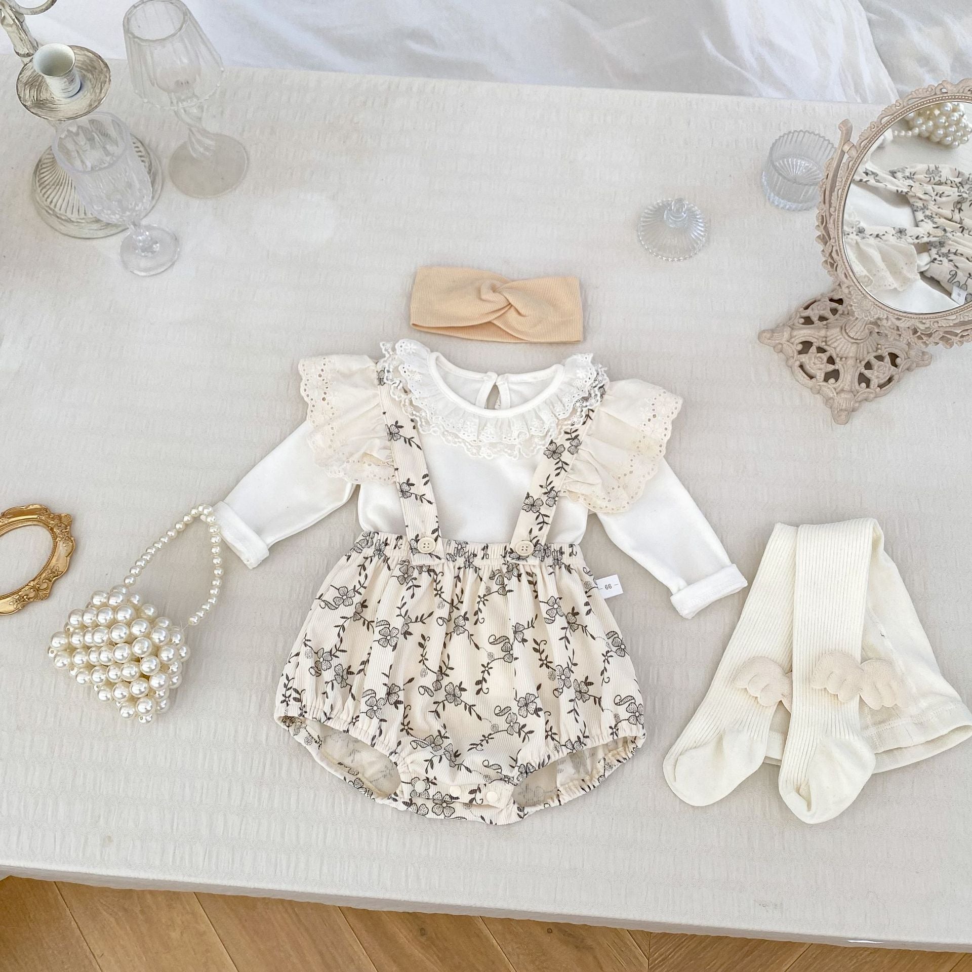 A beige and apricot long-sleeve top for baby girls featuring a floral print, made from soft cotton, perfect for autumn and spring.