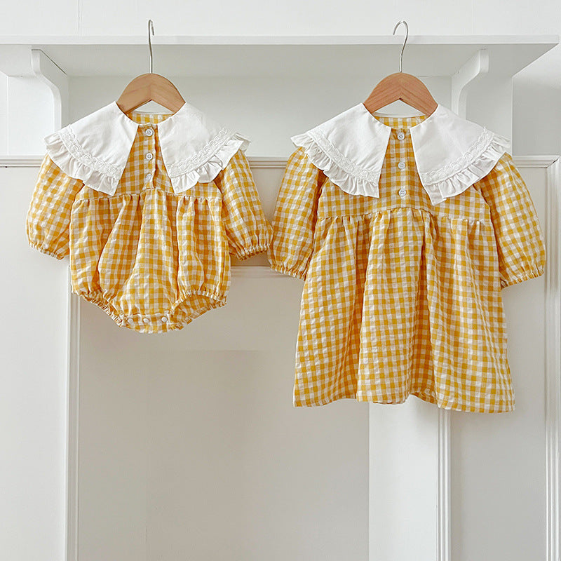 A stylish long-sleeved plaid shirt for baby girls in yellow and light yellow, featuring a French collar, perfect for autumn wear.