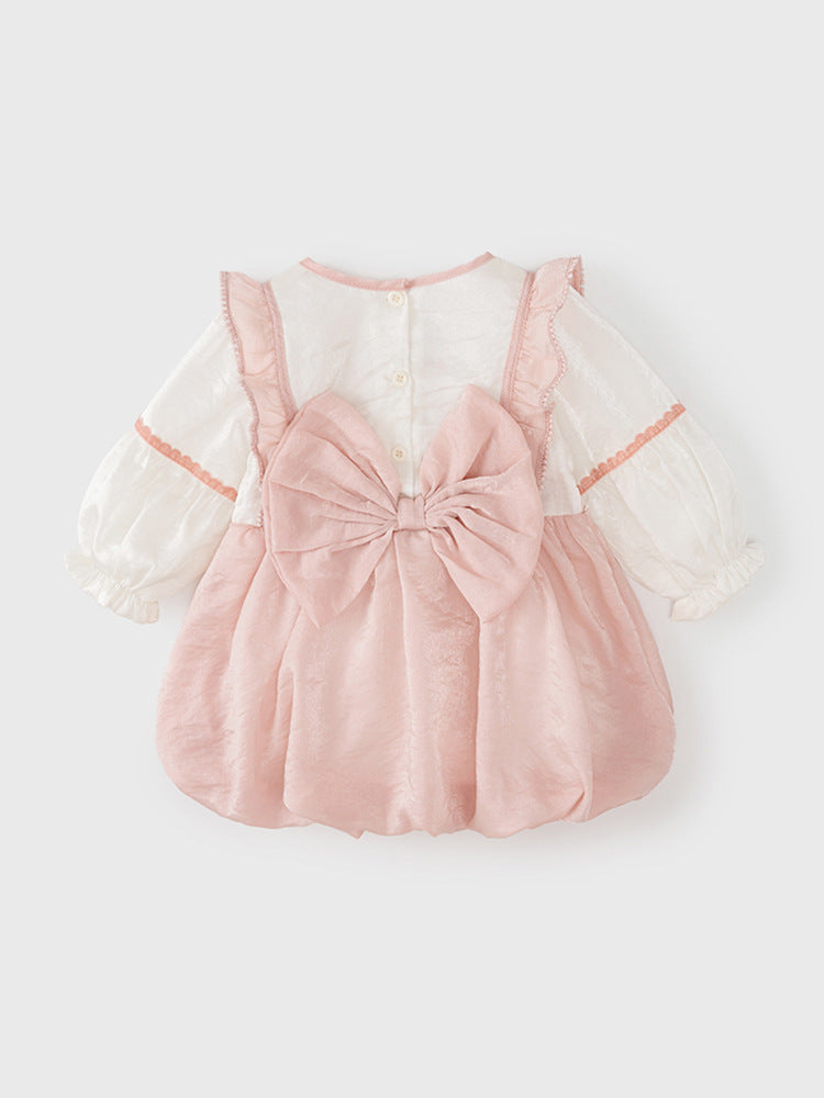 A cute baby girl wearing a pink long sleeve dress with floral embroidery and a V neck, perfect for autumn and spring seasons.