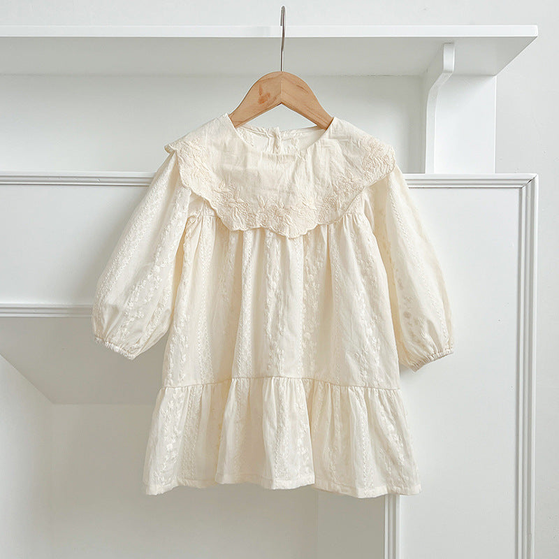 A collection of Arrival Autumn Baby Kids Girls outfits in beige and apricot colors featuring floral and geometric designs, made from soft cotton.