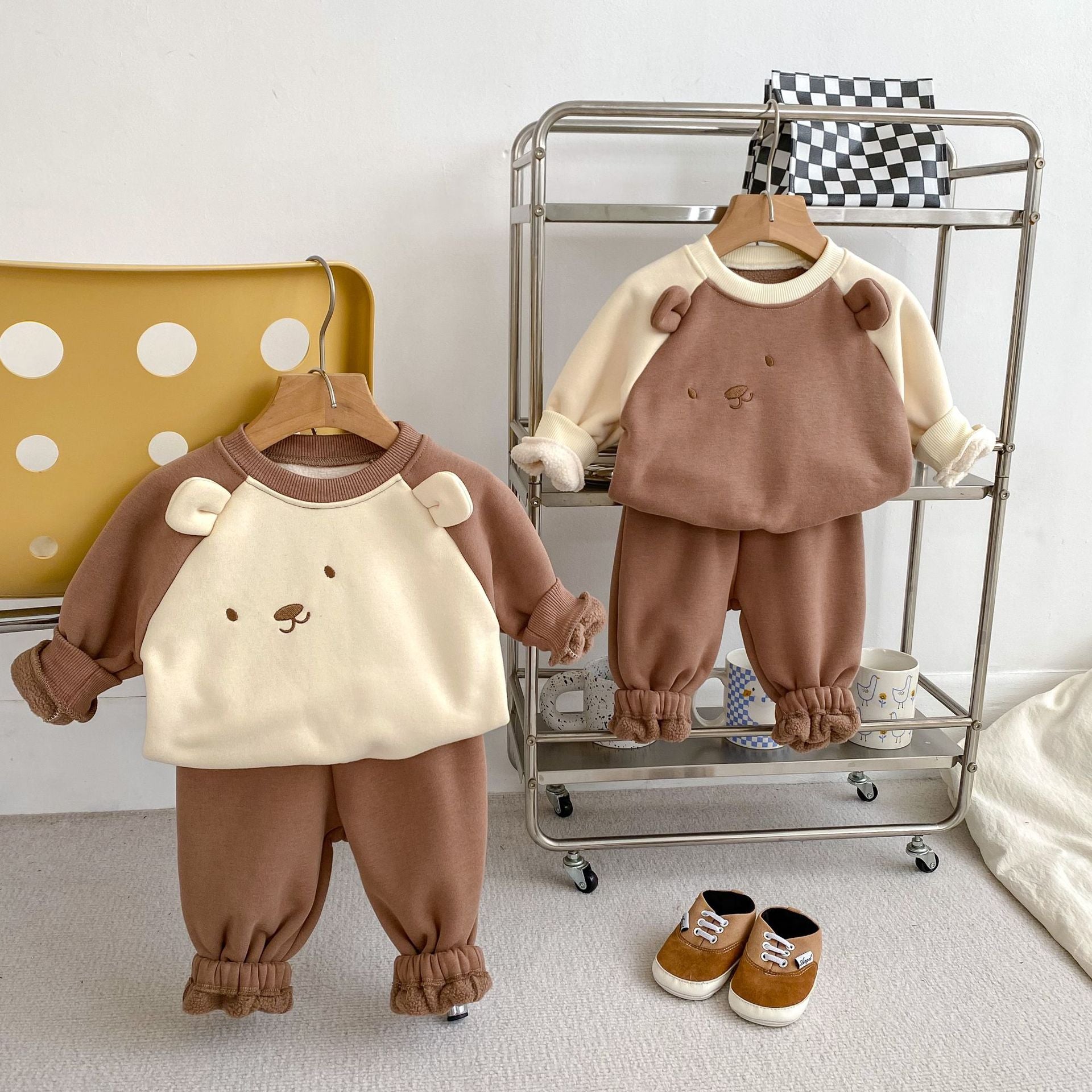 A beige and brown long sleeve pullover for babies featuring a cute bear design, perfect for autumn and winter wear.