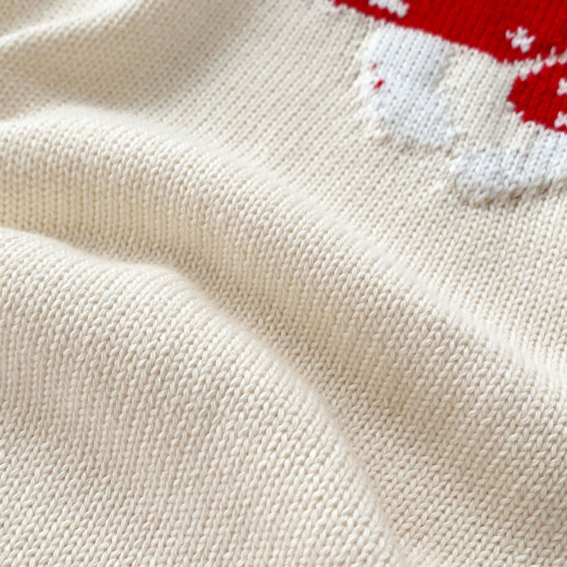 A soft cotton long-sleeved baby top featuring a jacquard mushroom pattern in grey and apricot colors, suitable for both boys and girls.