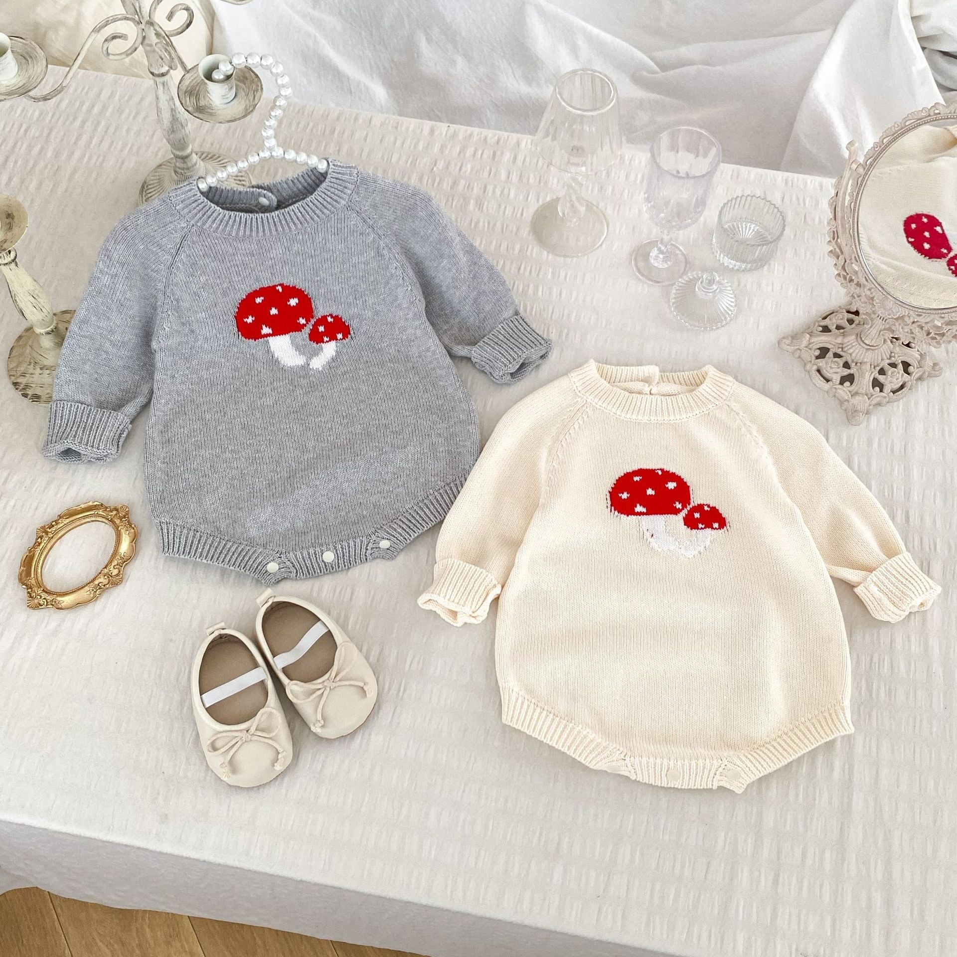 A soft cotton long-sleeved baby top featuring a jacquard mushroom pattern in grey and apricot colors, suitable for both boys and girls.