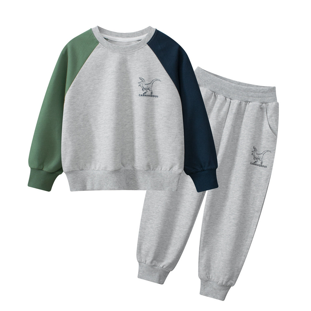 A navy blue and grey long sleeve pullover for boys featuring a playful dinosaur print, made from soft cotton material.