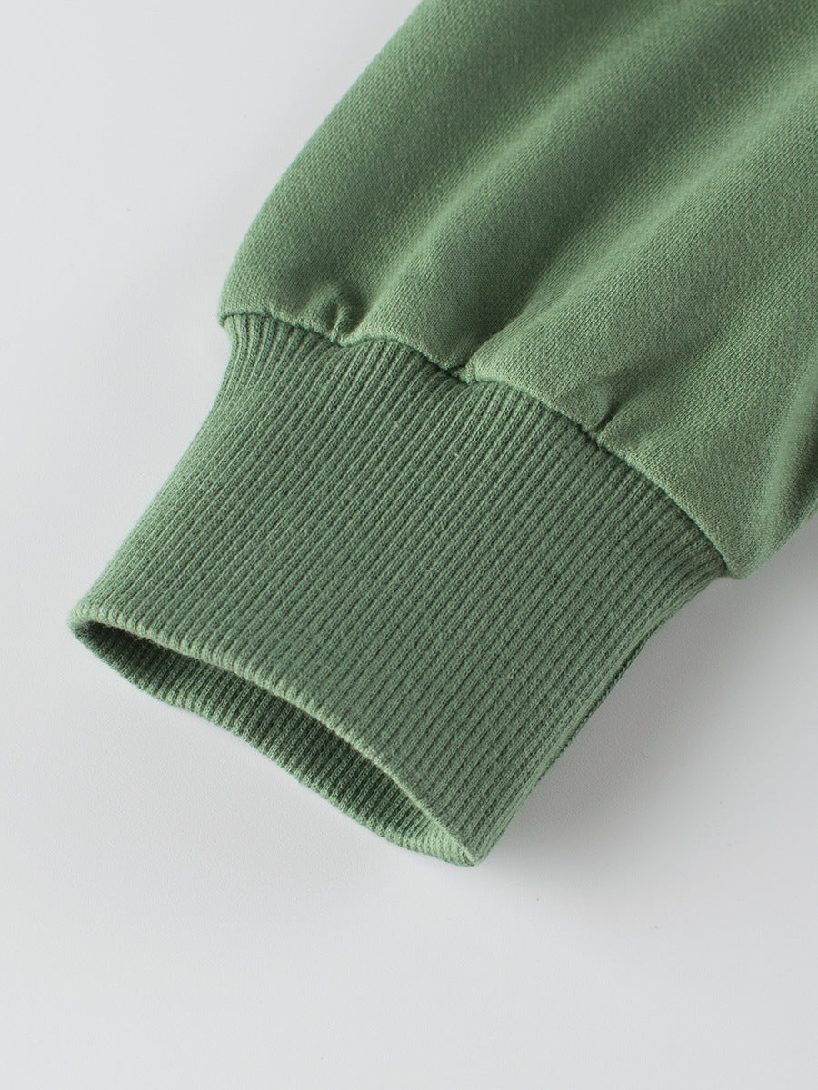 A navy blue and grey long sleeve pullover for boys featuring a playful dinosaur print, made from soft cotton material.