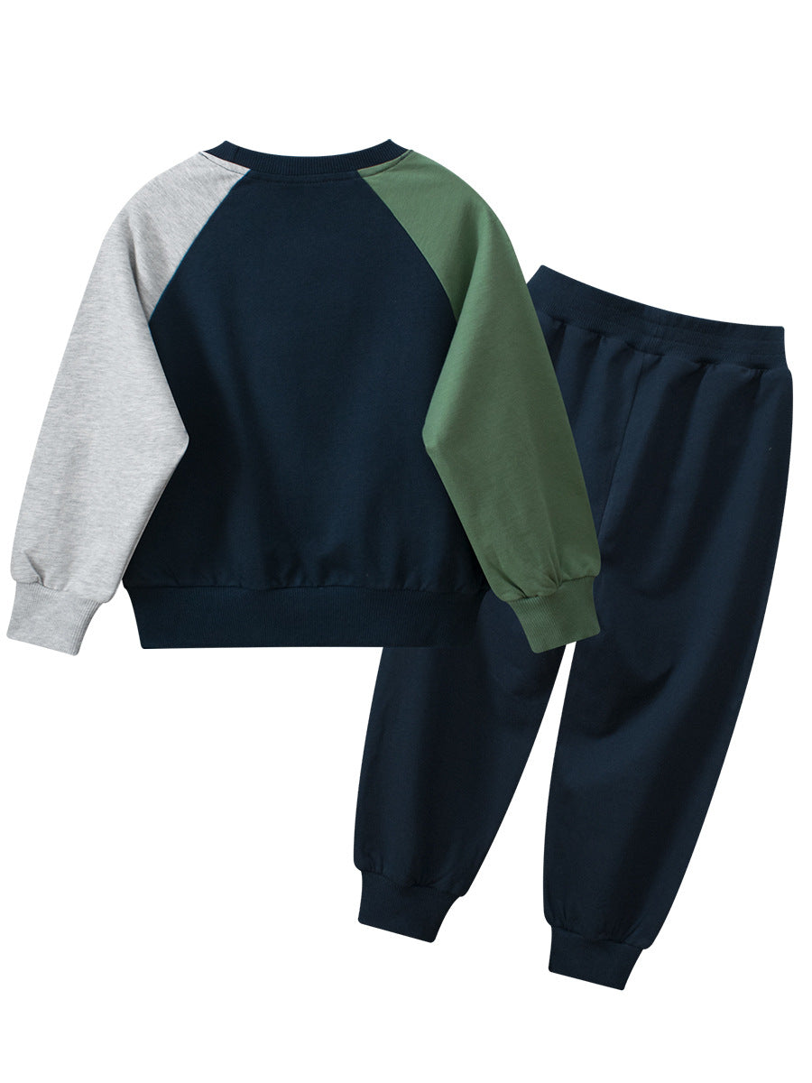 A navy blue and grey long sleeve pullover for boys featuring a playful dinosaur print, made from soft cotton material.
