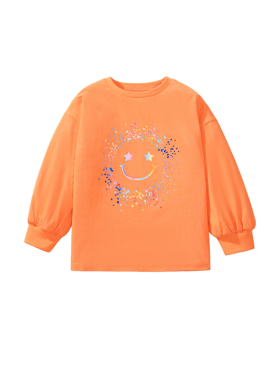 Bright orange long sleeve shirt for girls featuring a smiling face cartoon pattern, made from soft cotton material.