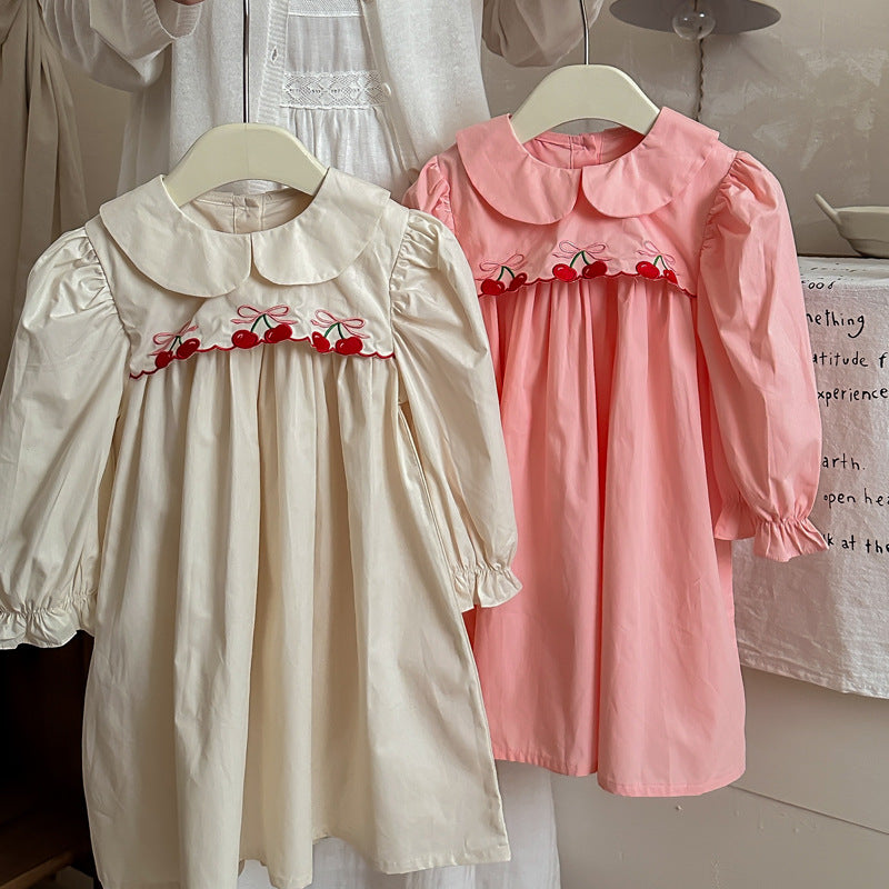 Arrival Autumn Girls Cherry Embroidery Long Sleeves Peter Pan Collar dress in pink and apricot colors, featuring a charming cherry design.