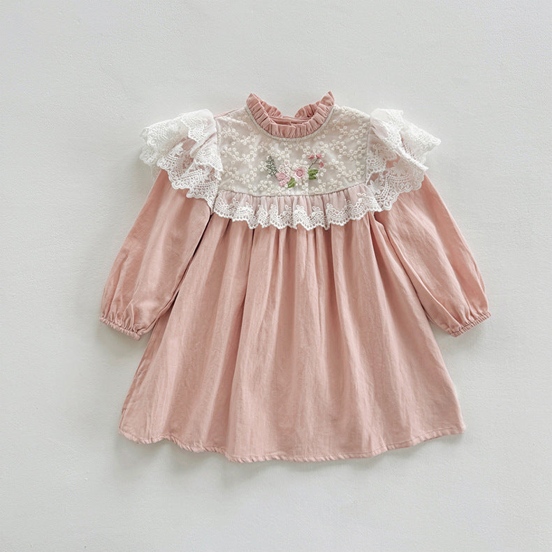 A pink long-sleeve dress for girls featuring floral embroidery and ruffle details, perfect for autumn and spring wear.