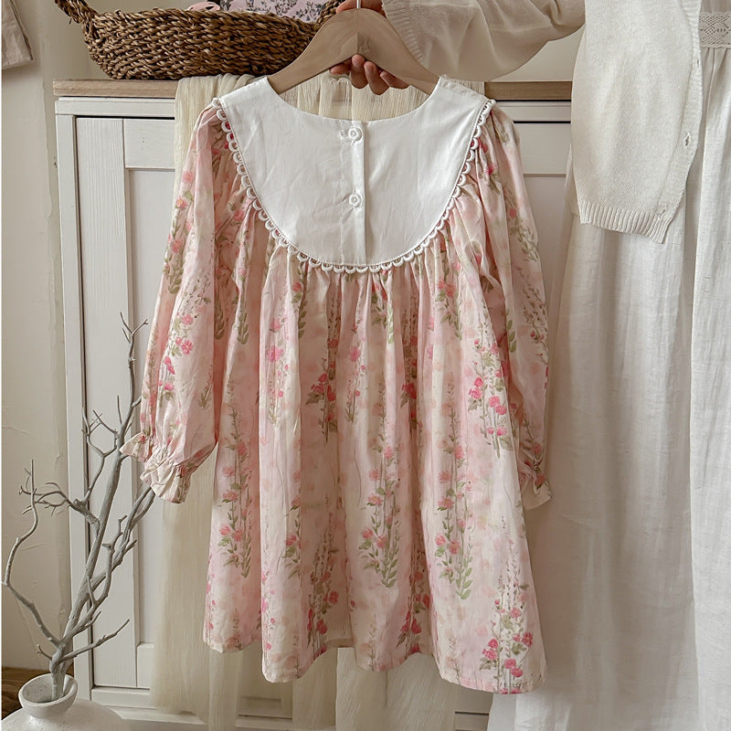 A pink crew neck long sleeve top for girls featuring a floral pattern, perfect for autumn and spring wear.