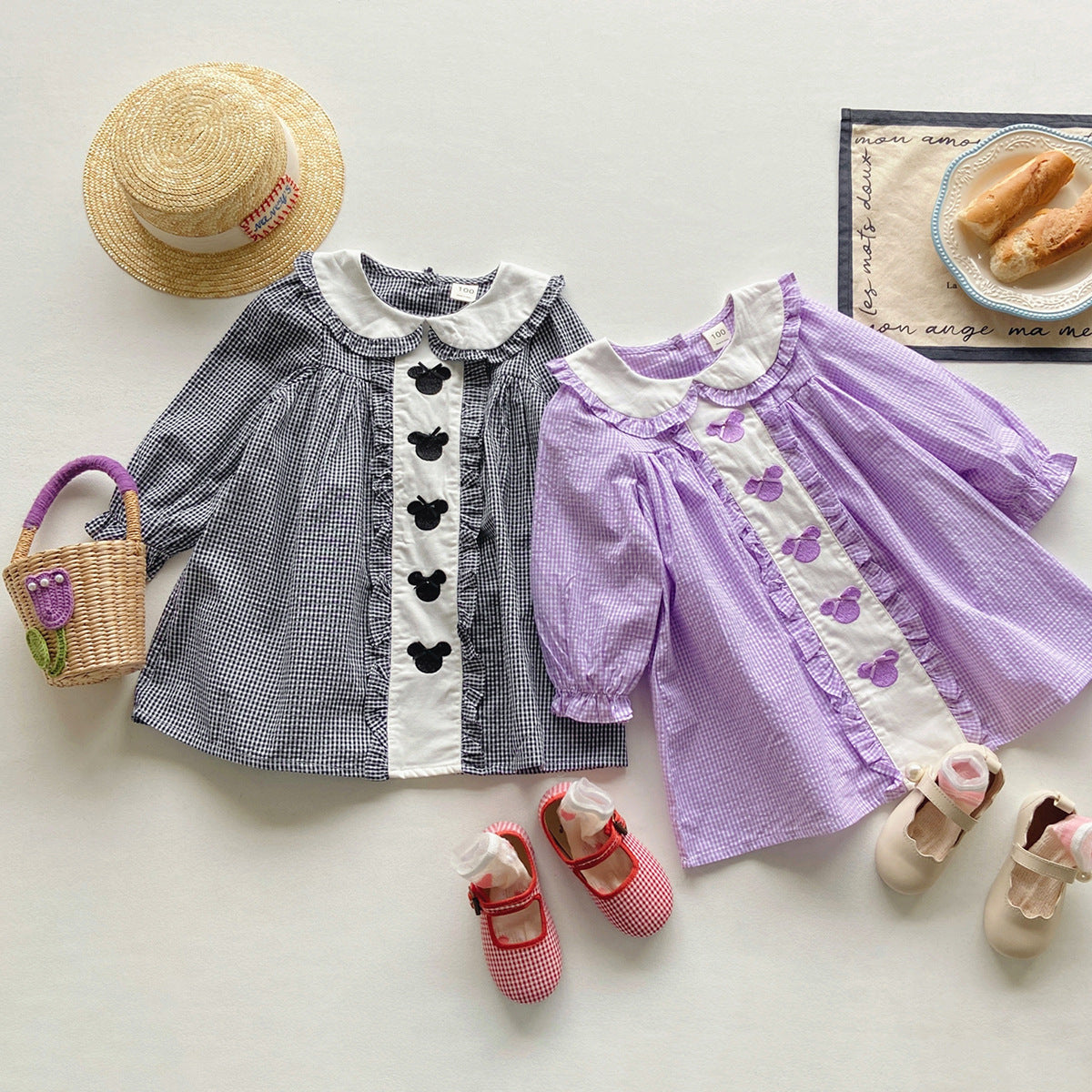 A stylish long sleeve shirt for girls featuring Mickey Mouse embroidery, available in black and purple colors, made from soft cotton.