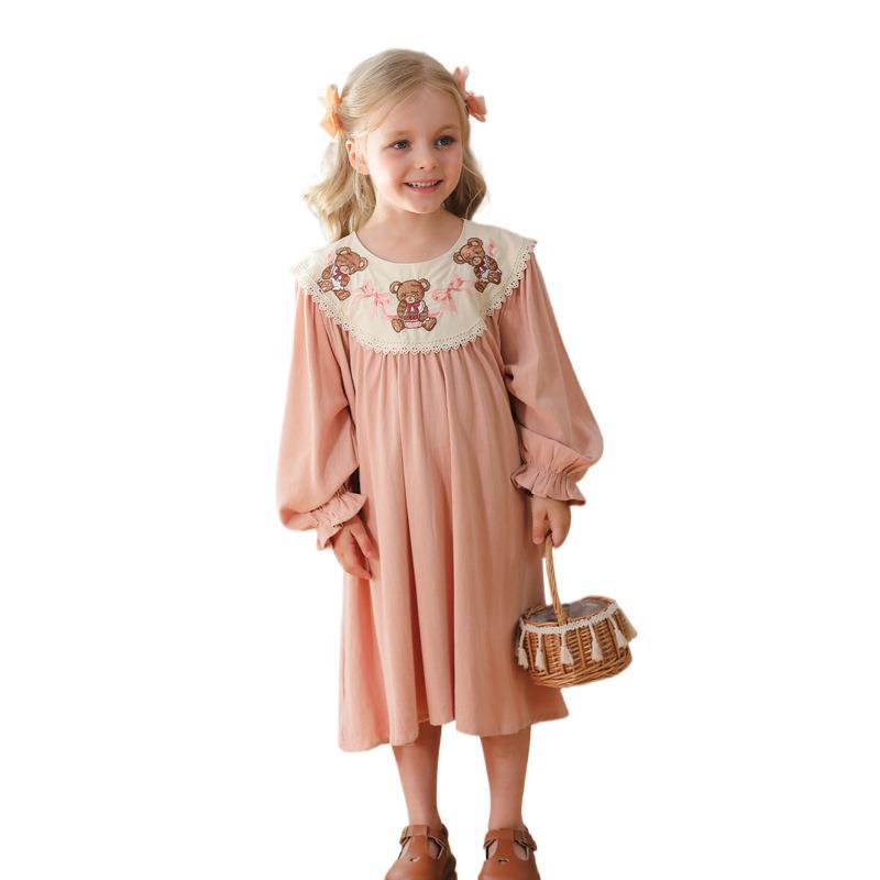 A charming pink long sleeves dress for girls featuring teddy embroidery, perfect for autumn and spring wear.