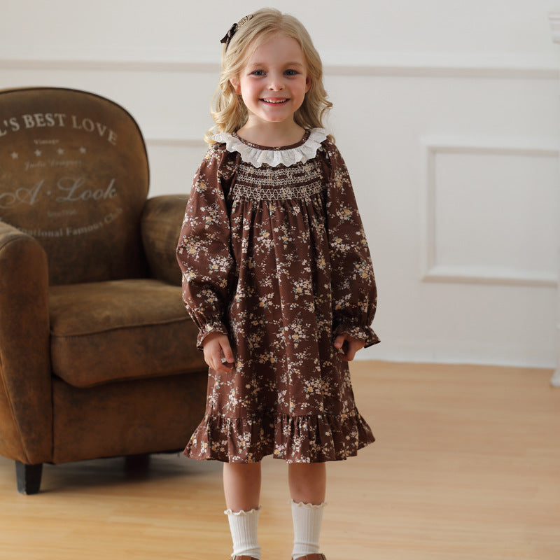 A charming vintage-style dress for girls featuring a ruffle collar and floral pattern, perfect for autumn and spring wear.