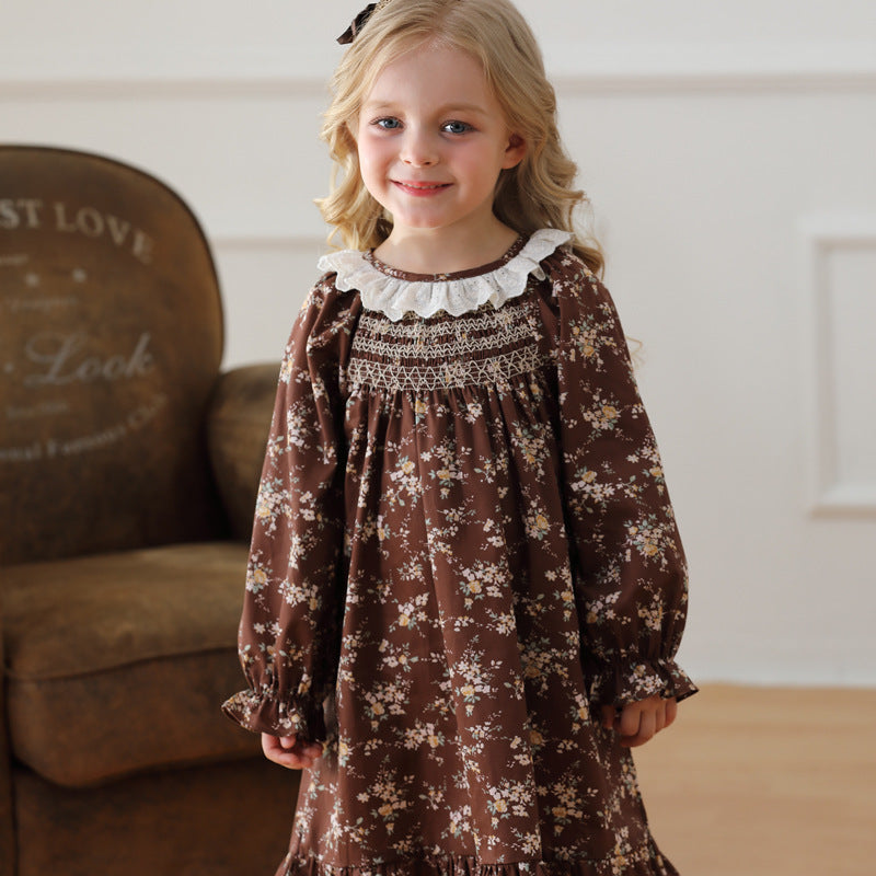 A charming vintage-style dress for girls featuring a ruffle collar and floral pattern, perfect for autumn and spring wear.