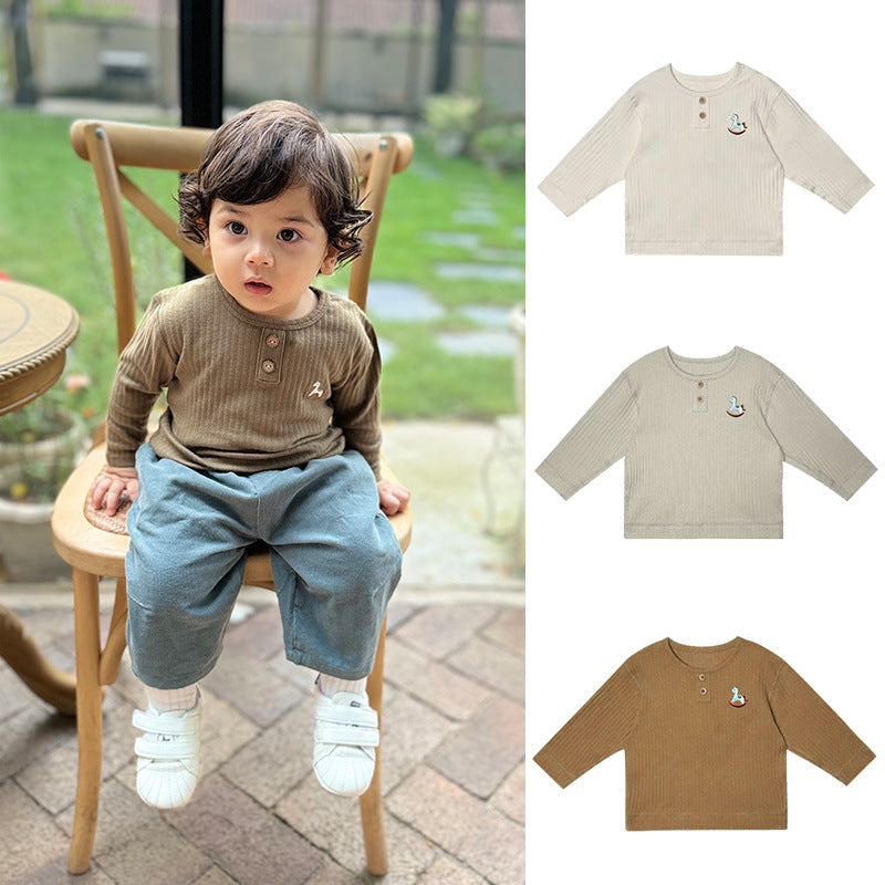 A soft cotton long sleeve shirt for kids featuring a playful horse embroidery, available in green, yellow, khaki, and beige colors.