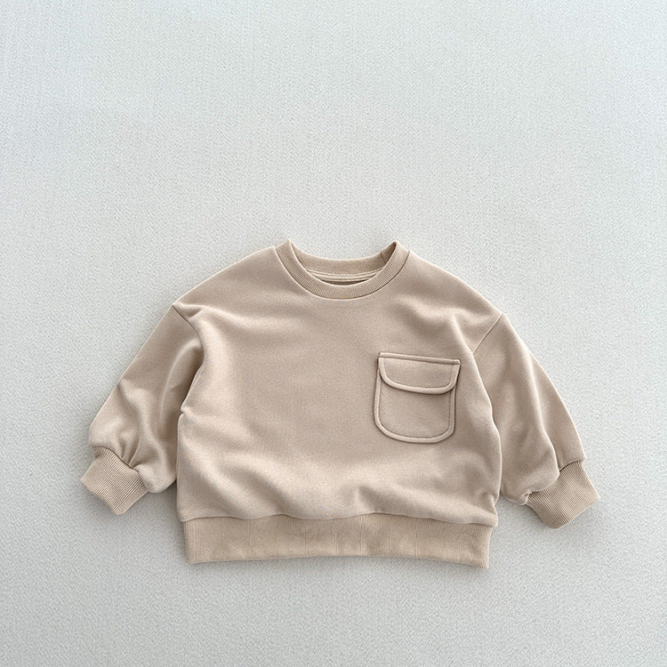 A soft and comfortable unisex long sleeves top for kids in khaki and beige colors, made from cotton fabric.