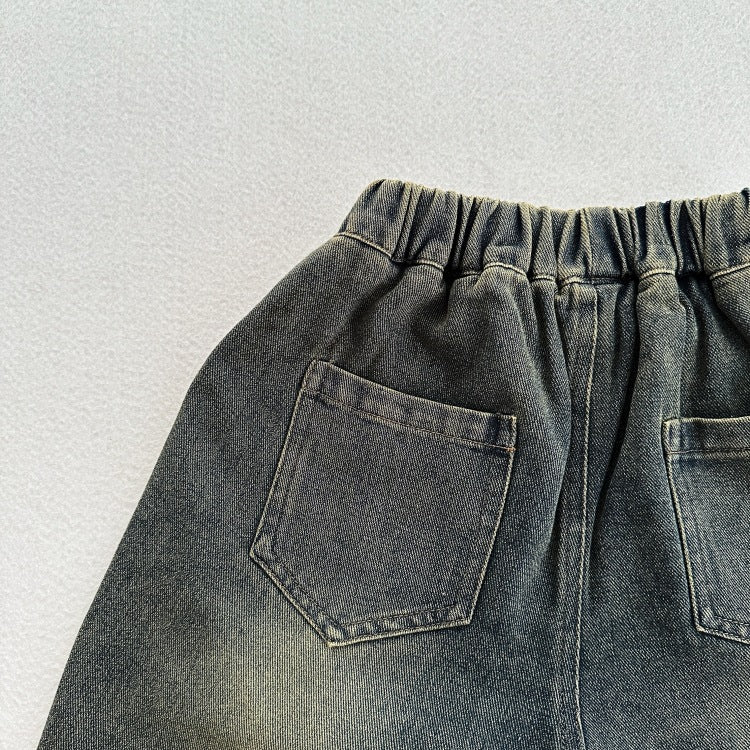 A stylish unisex vintage blue denim outfit for kids, featuring an elastic waistband and made from soft cotton denim, perfect for spring and autumn.