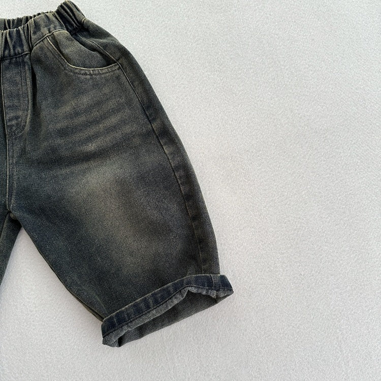A stylish unisex vintage blue denim outfit for kids, featuring an elastic waistband and made from soft cotton denim, perfect for spring and autumn.