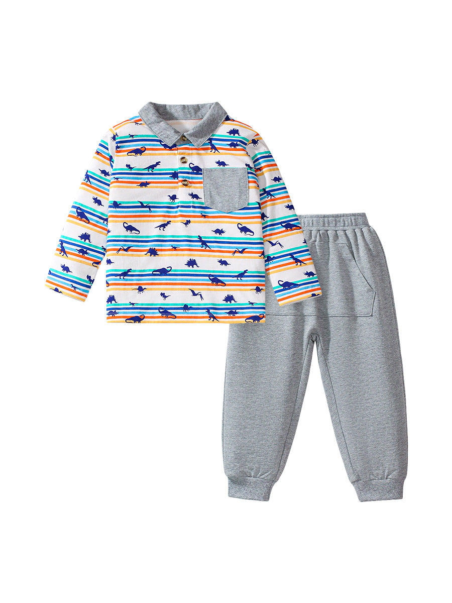 A grey long-sleeve shirt featuring a playful dinosaur print and striped pattern, perfect for boys aged 12 months to 10 years.