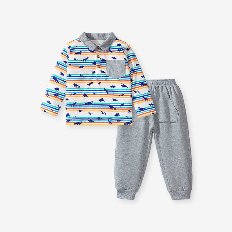 A grey long-sleeve shirt featuring a playful dinosaur print and striped pattern, perfect for boys aged 12 months to 10 years.