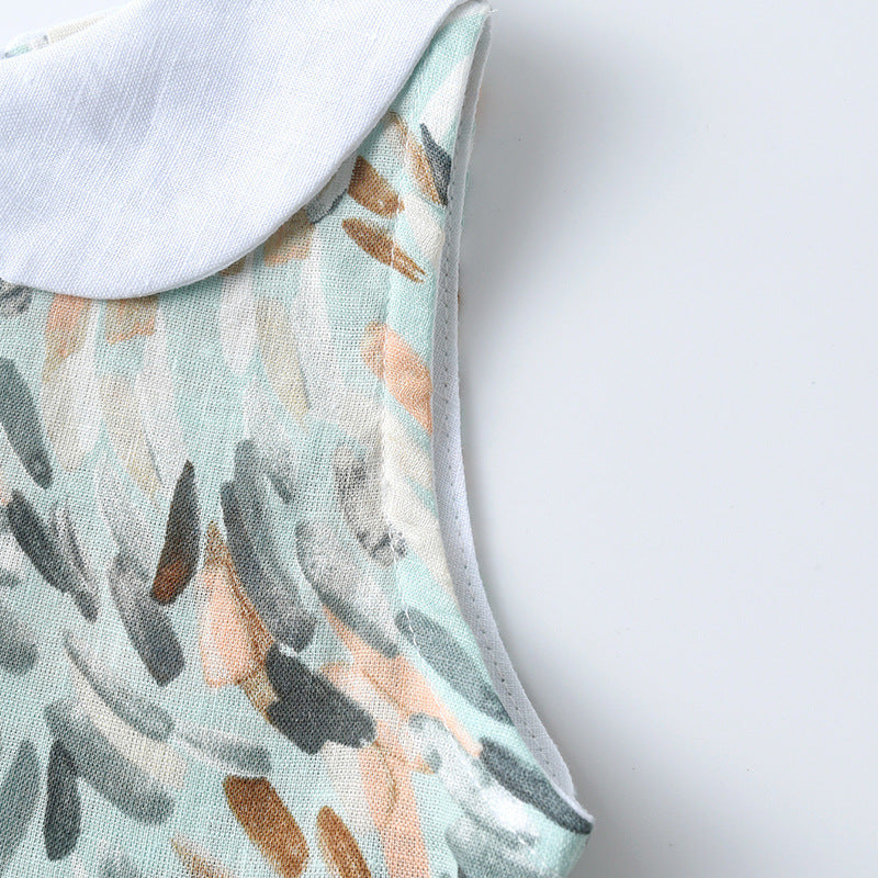 Colorful sleeveless dress for girls with Peter Pan collar and geometric pattern, perfect for summer wear.