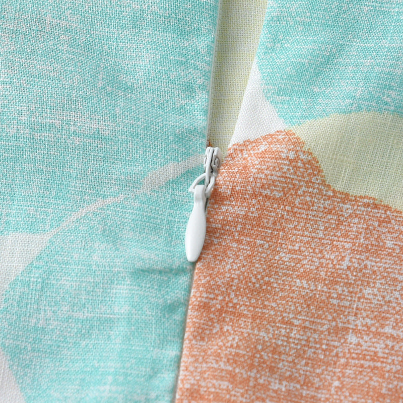 Colorful sleeveless dress for girls with Peter Pan collar and geometric pattern, perfect for summer wear.