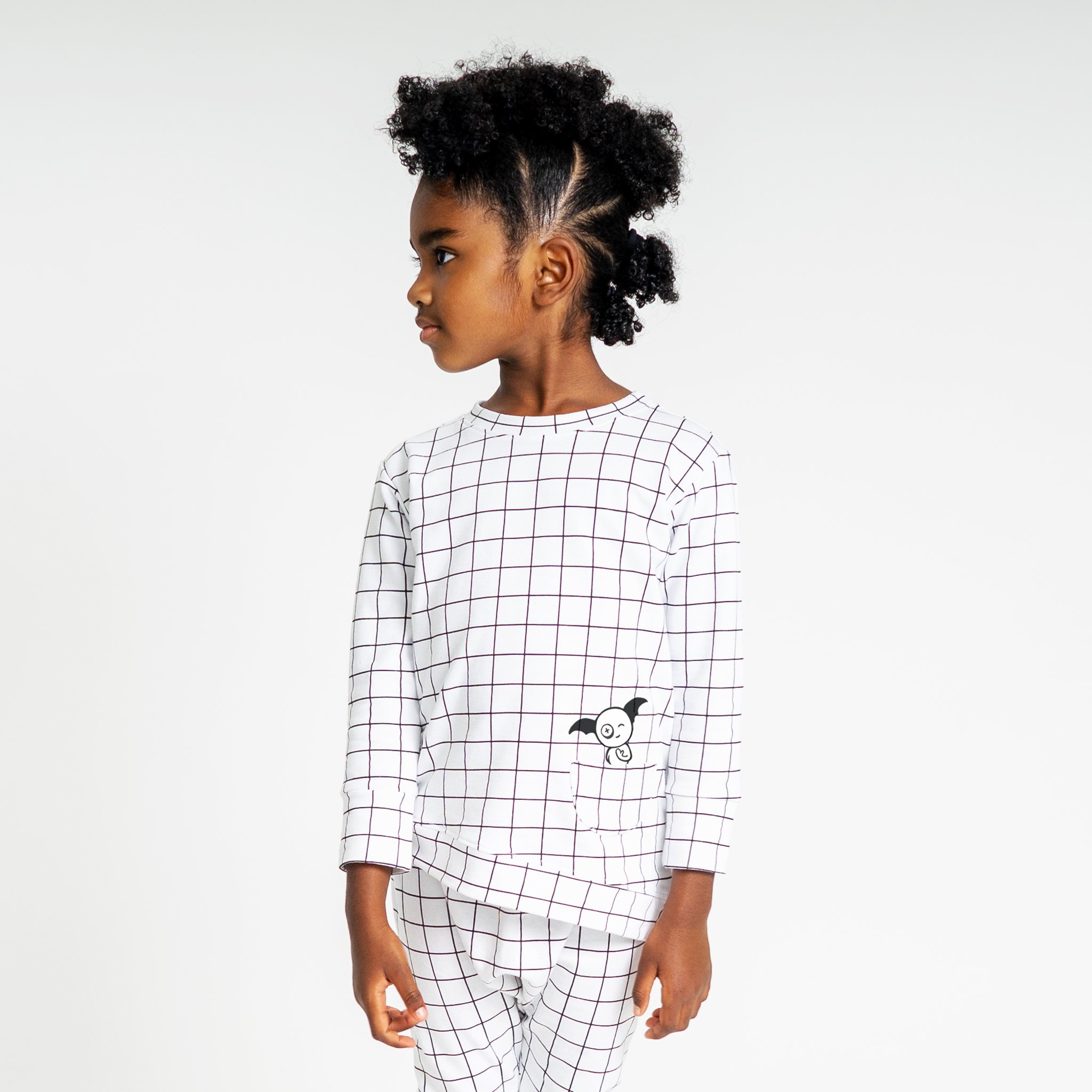 Asymmetric Pullover in Black and White Grid with a monster peek-a-boo pocket and thumbholes for toddlers.