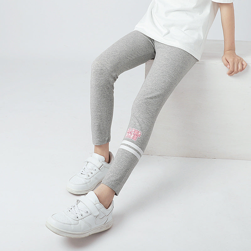 A pair of Autumn Baby Girl Breathable Elastic Leggings in pink, navy blue, and grey, showcasing a comfortable elastic waistband and playful letters pattern.