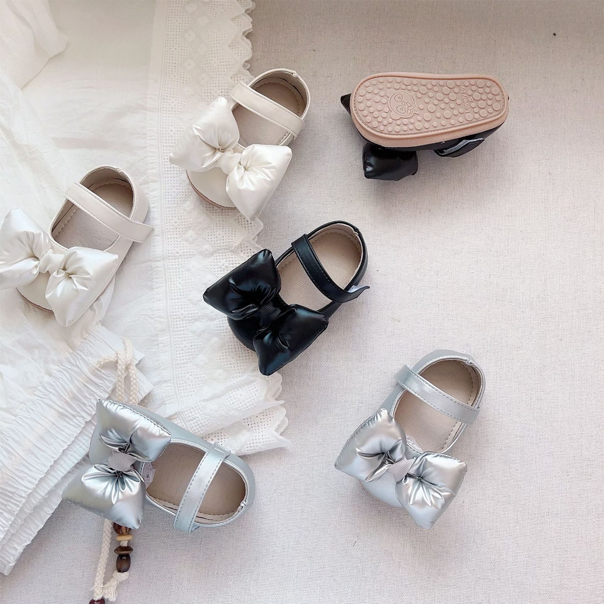 Autumn Baby Girl Butterfly Bow Soft-Sole Shoes in Black, Grey, and Beige with anti-slip sole for toddlers.