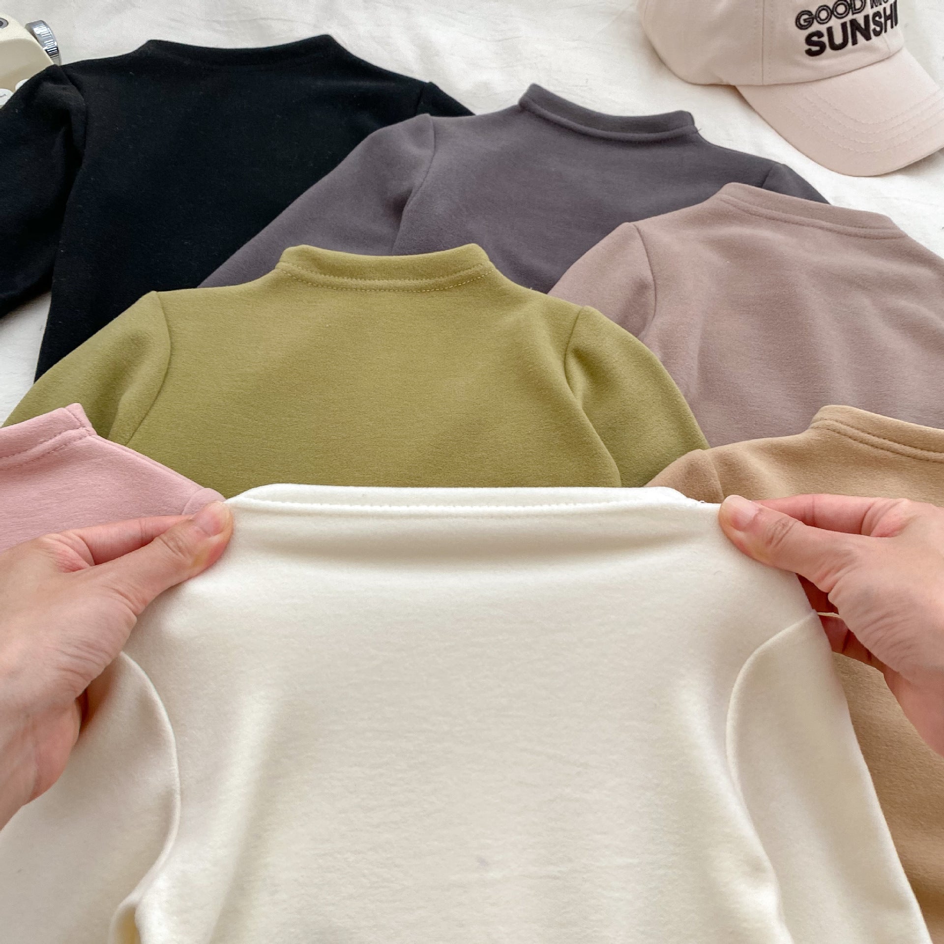 Autumn Baby Kids Unisex Long Sleeves Turtle Neck Cozy Fleece in various colors, showcasing its soft texture and stylish design.