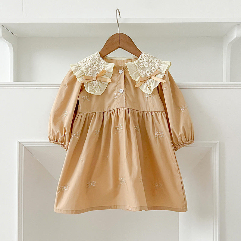 A long sleeve top featuring an autumn bows pattern and embroidered daisy flowers collar, designed for baby girls.