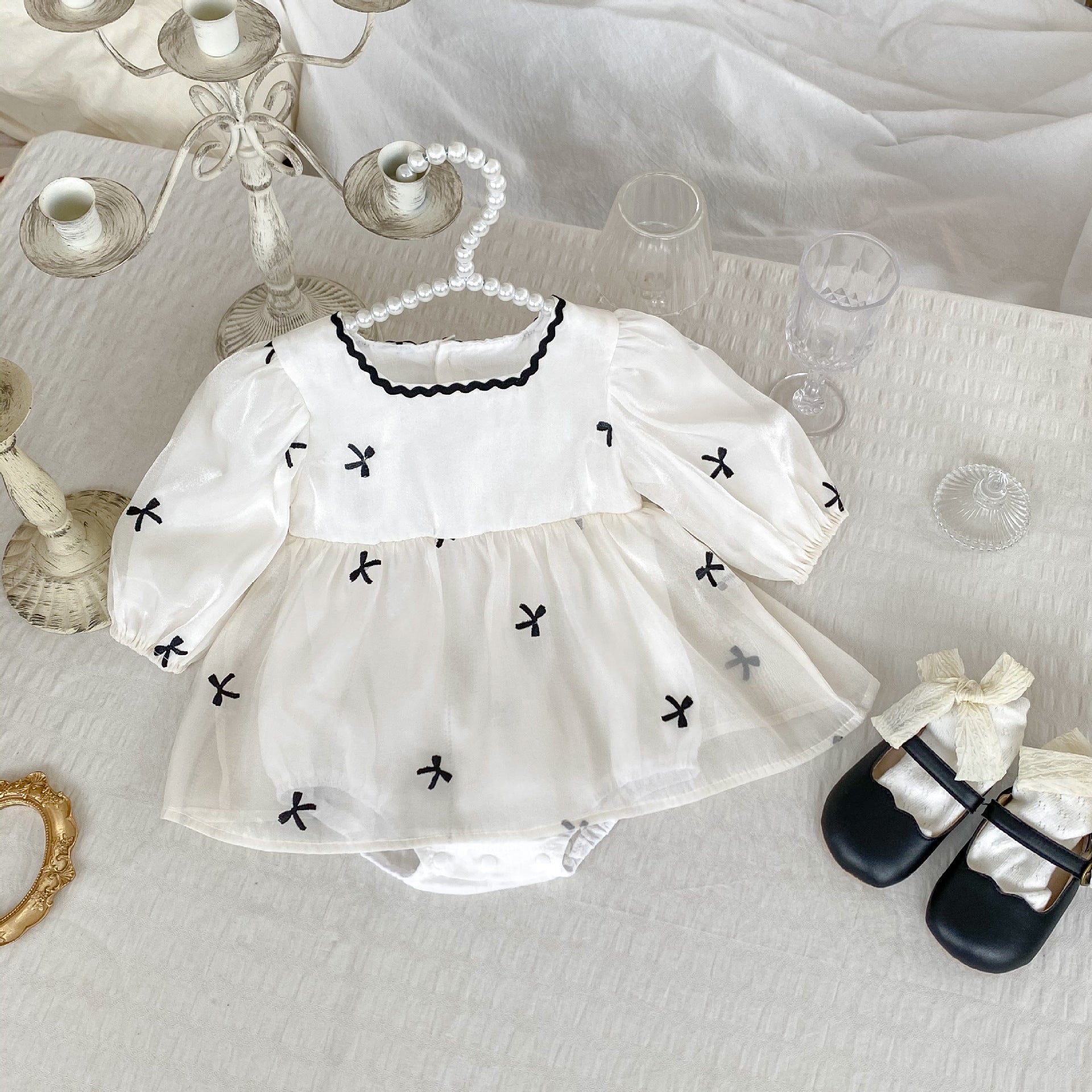 White long sleeve onesie with autumn bows embroidery design for baby girls, featuring a square neck and soft cotton material.