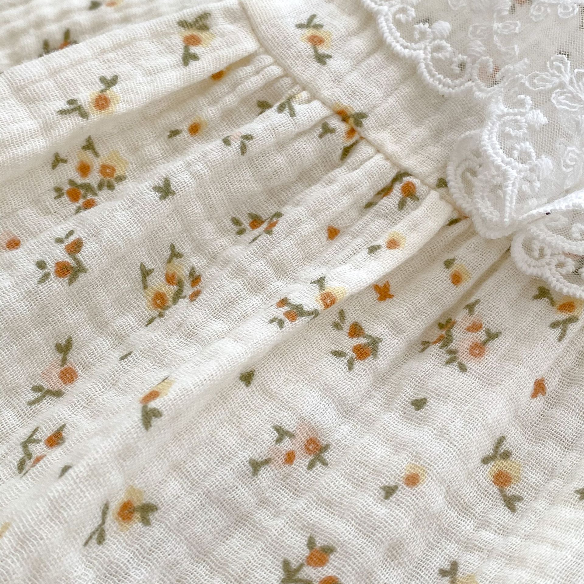 Autumn Ditsy Flower Pattern Mesh Collar Onesies in apricot color for baby girls, featuring a floral design and soft cotton material.