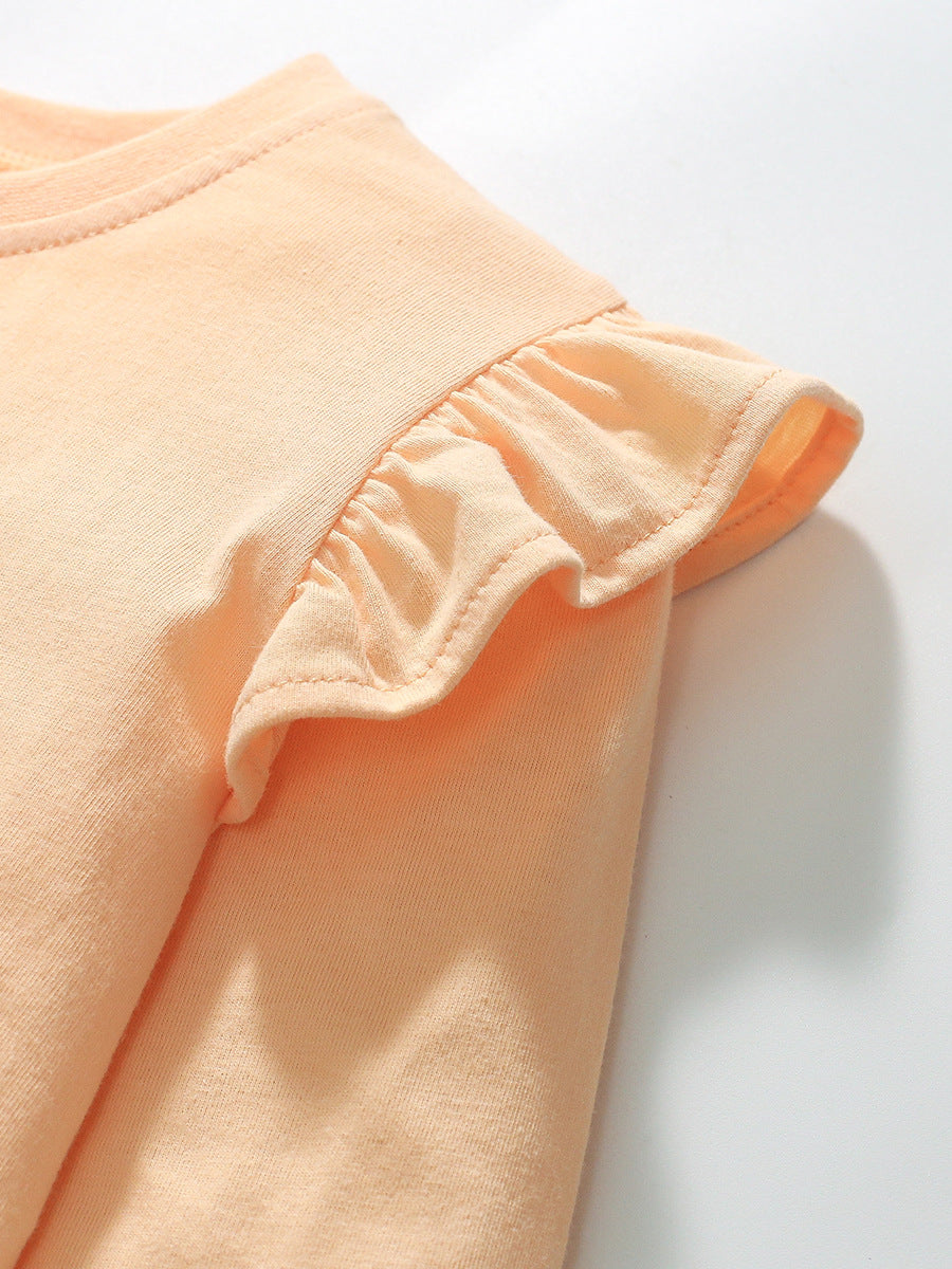 A cute long-sleeved t-shirt for girls featuring a rabbit cartoon pattern, made from soft cotton in apricot color.